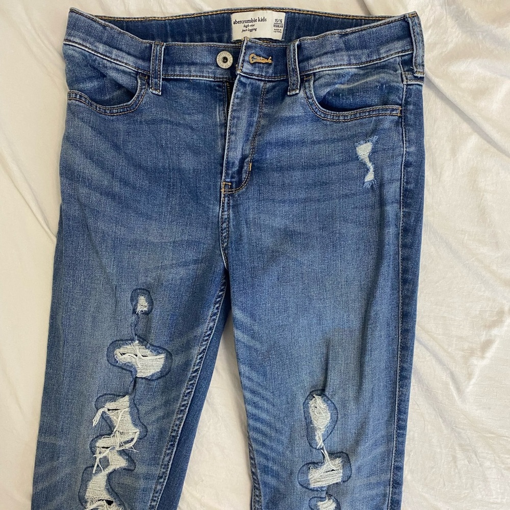 Abercombrie Kids skinny medium wash jeans.